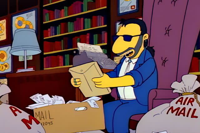 <p>Fox/Disney+</p> Ringo Starr reading fanmail in 'Brush With Greatness'