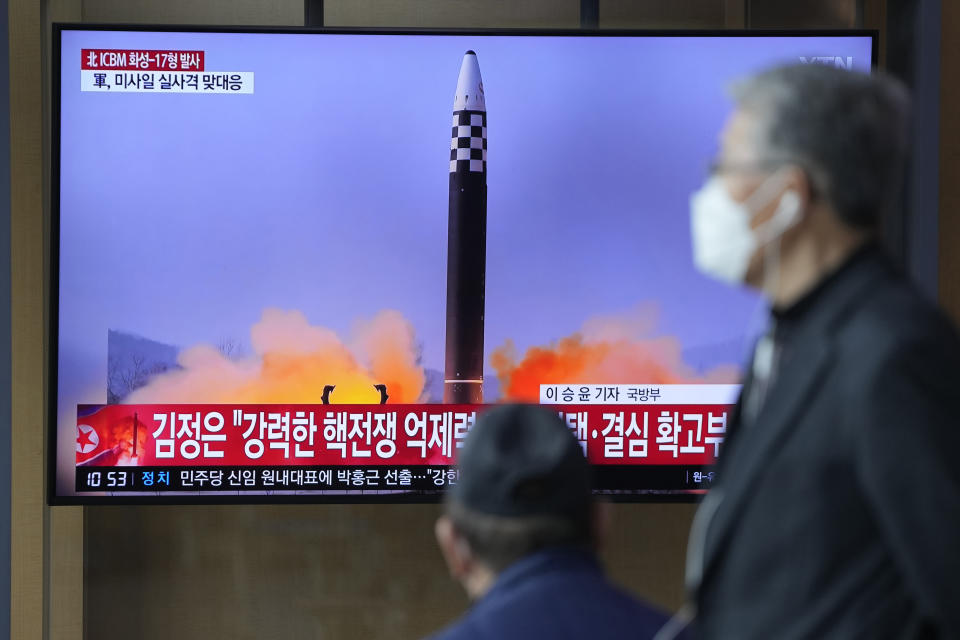 FILE - People watch a television screen showing a news program reporting about North Korea's intercontinental ballistic missile (ICBM) at a train station in Seoul, South Korea, Friday, March 25, 2022. A major United Nations meeting on the landmark nuclear Non-Proliferation Treaty is starting Monday, Aug. 1, 2022, after a long delay due to the COVID-19 pandemic, as Russia’s war in Ukraine has reanimated fears of nuclear confrontation and cranked up the urgency of trying reinforce the 50-year-old treaty. (AP Photo/Lee Jin-man, File)
