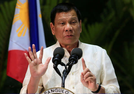 Philippine President Rodrigo Duterte gestures while answering questions during a news conference upon arrival from a trip to Myanmar and Thailand at an international airport in Manila, Philippines March 23, 2017. REUTERS/Romeo Ranoco