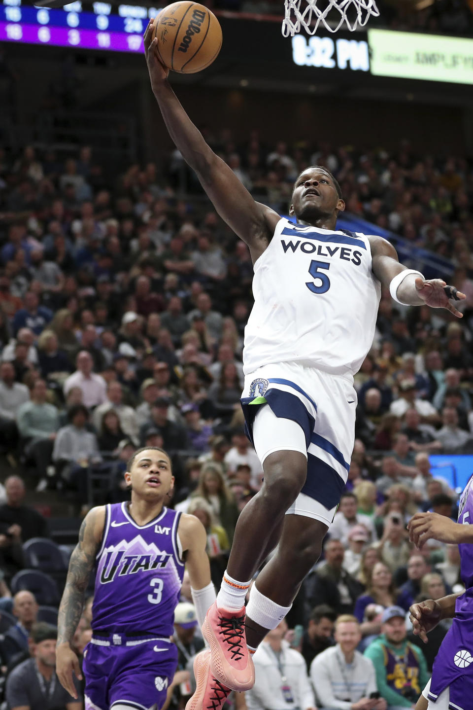 Minnesota Timberwolves guard Anthony Edwards (5) lays the ball up during the second half of an NBA basketball game against the Utah Jazz Monday, March 18, 2024, in Salt Lake City. (AP Photo/Adam Fondren)