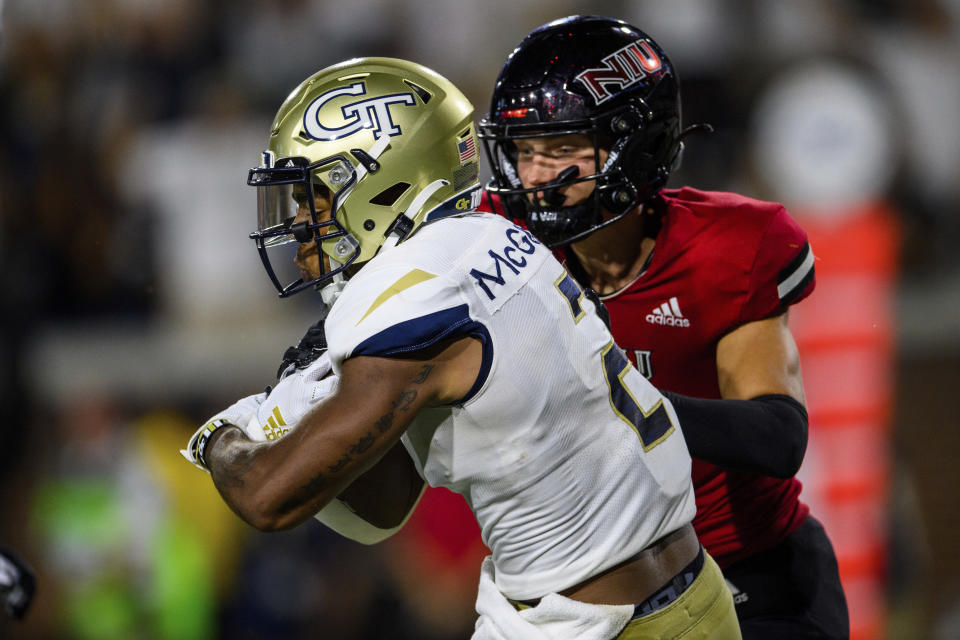 Georgia Tech wide receiver Kyric McGowan (2) scores a touchdown as Northern Illinois safety Jordan Hansen (7) defends during the first half of an NCAA college football game, Saturday, Sept. 4, 2021, in Atlanta. (AP Photo/Danny Karnik)