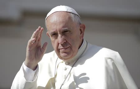 Pope Francis waves as he arrives to lead his Wednesday general audience in Saint Peter's square at the Vatican June 17, 2015. REUTERS/Max Rossi