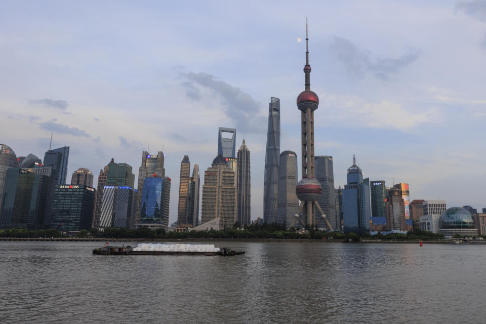 SHANGHAI, CHINA - JULY 10: A cargo boat drives in the Huangpu river on July 10, 2022 in Shanghai, China. (Photo by Hugo Hu/Getty Images)