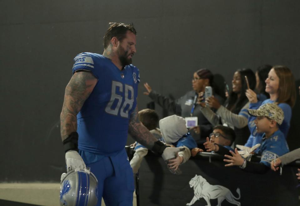 Detroit Lions offensive tackle Taylor Decker (68) runs up the tunnel after the 31-26- win against the Chicago Bears at Ford Field Sunday, Nov. 19, 2023.