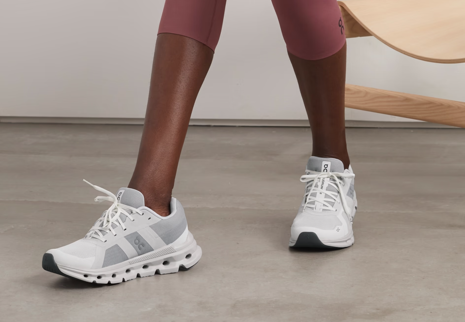 A model wearing On Cloudrunner mesh sneakers. (PHOTO: Net-A-Porter)