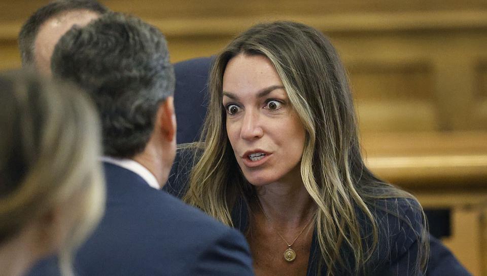 Karen Read speaks with her lawyer as the jury deliberates in her murder trail, Wednesday June 26, 2024, at Norfolk Superior Court in Dedham, Mass. Read is charged with second-degree murder in the January 2022 death of her boyfriend Boston Police Officer John O’Keefe. (Greg Derr/The Patriot Ledger via AP, Pool)