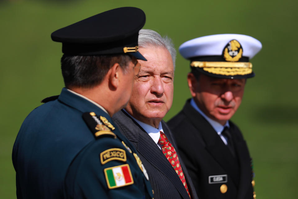 MEXICO CITY, MEXICO - JUNE 30: President of Mexico Andres Manuel Lopez Obrador (C) looks on during the ceremony of deployment of the new Mexican security force 'National Guard' at Campo Marte on June 30, 2019 in Mexico City, Mexico. The new force will be constitute by federal and military police as well as members of the Mexican Army. (Photo by Manuel Velasquez/Getty Images)