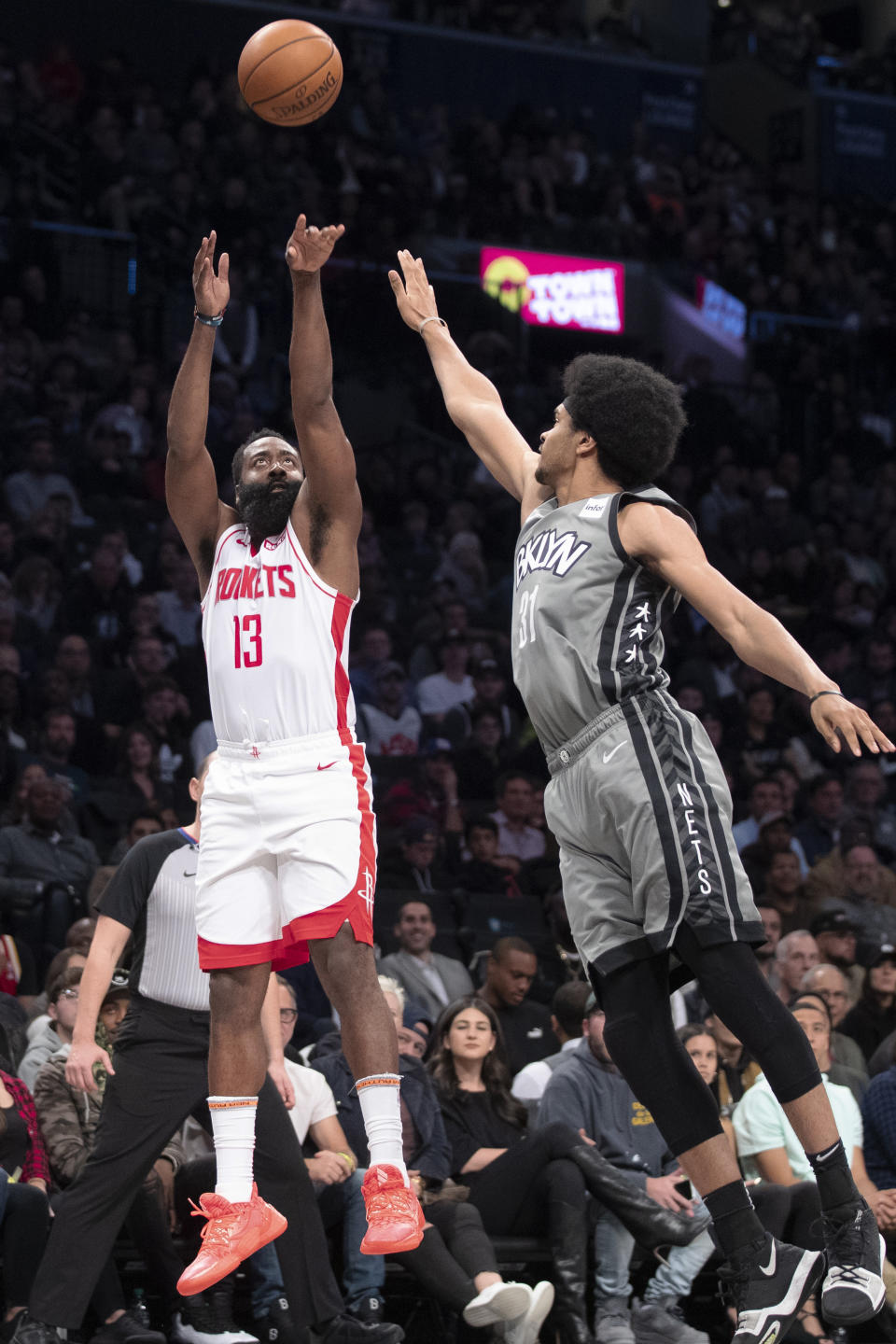 Houston Rockets guard James Harden (13) shoots a 3-pointer past Brooklyn Nets center Jarrett Allen during the first half of an NBA basketball game Friday, Nov. 1, 2019, in New York. (AP Photo/Mary Altaffer)