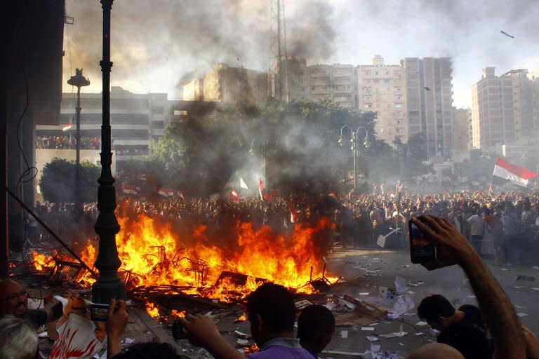 Opponents of Egyptian President Mohamed Morsi burn the content of a Freedom and Justice Party office in the coastal city of Alexandria on June 28, 2013. The country braced for nationwide protests against Morsi to mark the anniversary of his turbulent maiden year in office after violence at rival demonstrations killed three people, including an American