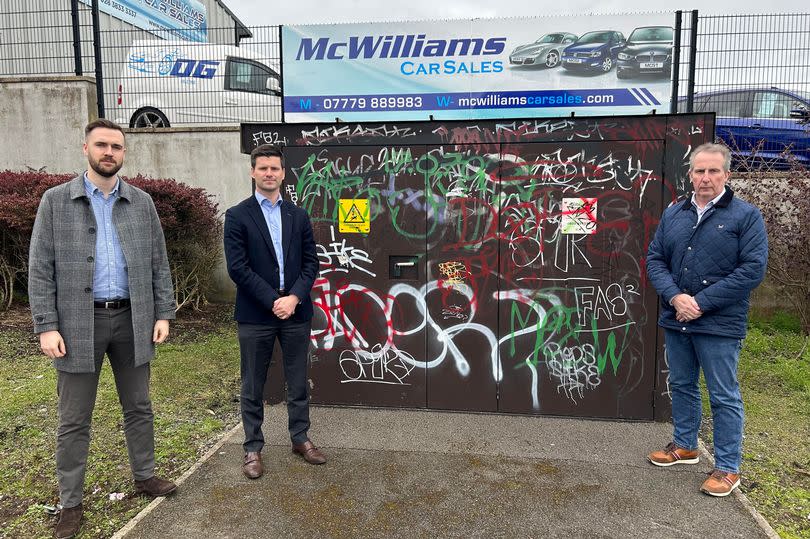 Cllr Kyle Moutray, Jonathan Buckley MLA and Cllr Lavelle McIlwrath at Meadow Lane Electric utility box in Portadown which is covered in graffiti