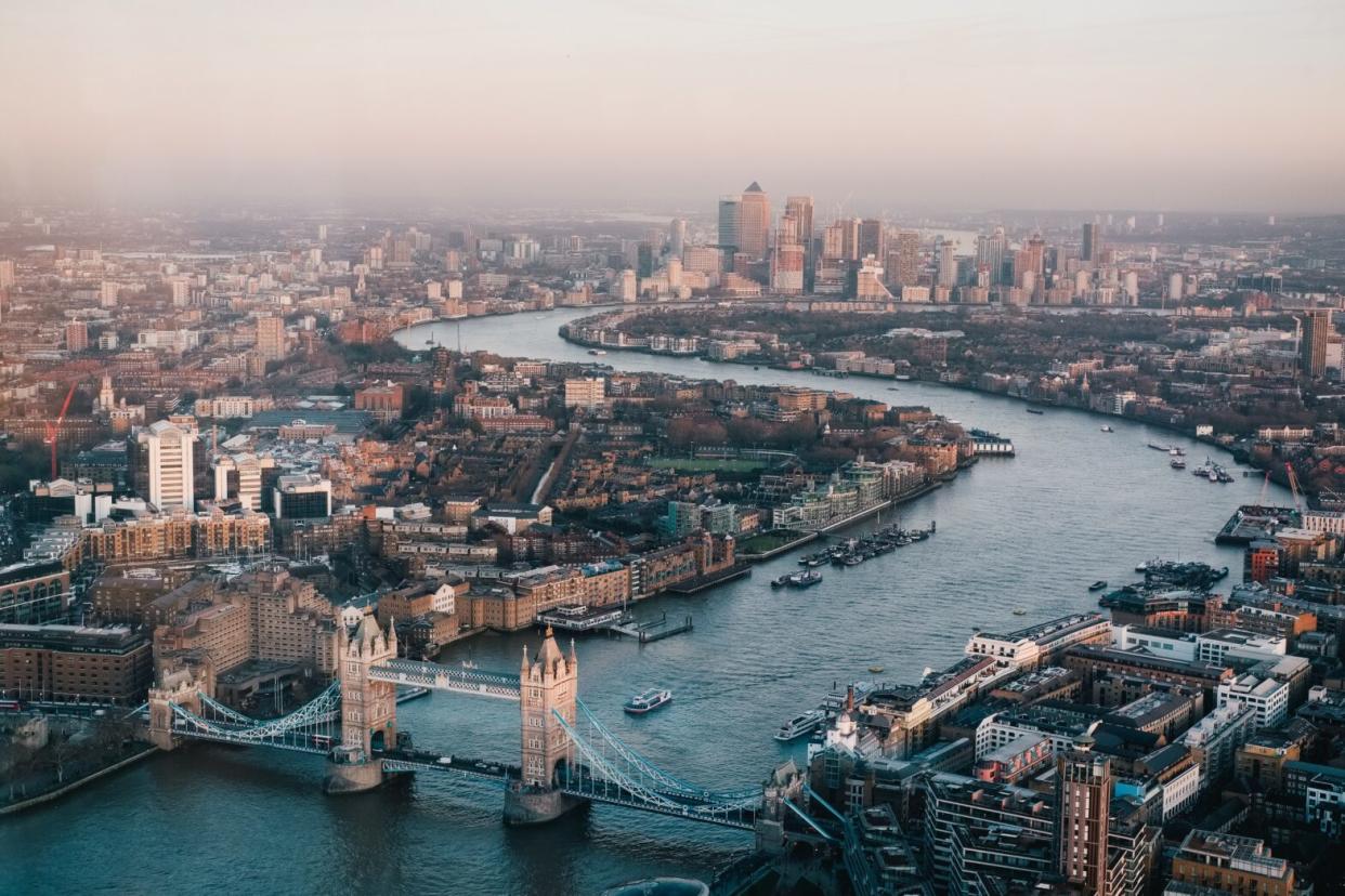 Check out this three day itinerary for London that includes tips for travel and the best sights to see. Pictured: A sky view of the Thames River and the metropolitan city of London