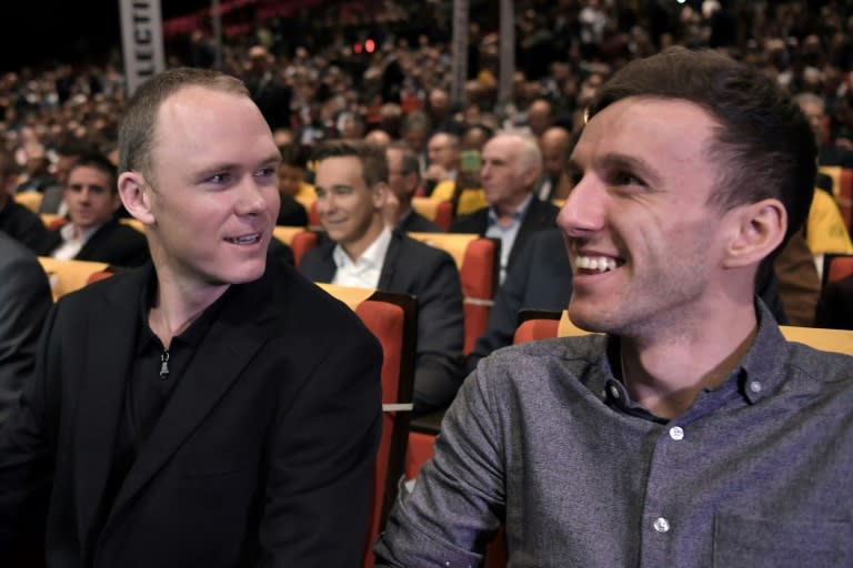 Britain's Chris Froome (left) jokes with Adam Yates as Tour de France officials unveil the route of the 2017 edition of the race, during a press conference in Paris, on October 18, 2016