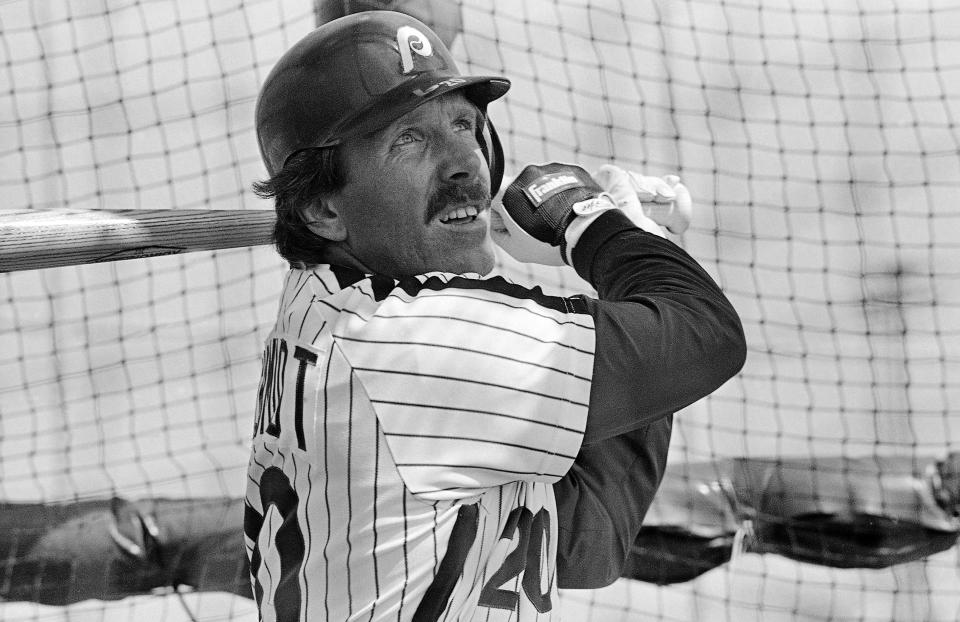 FILE - In this Feb. 23, 1984, file photo, Philadelphia Phillies' Mike Schmidt follows the flight of the ball as he takes batting practice during spring training baseball in Clearwater, Fla. The Hall of Fame third baseman was a three-time NL MVP and MVP of the 1980 World Series when the Philadelphia Phillies won their first championship. (AP Photo/Rusty Kennedy, File)