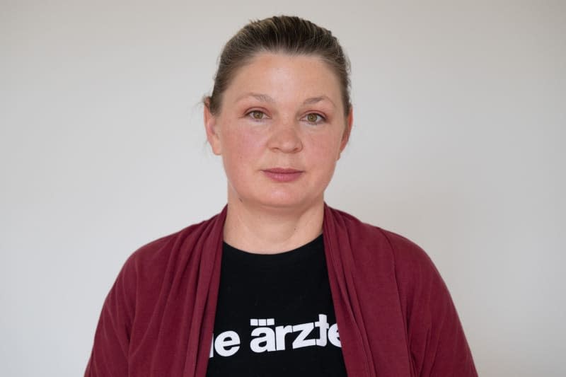 Yvonne Mosler, leading German Green Party candidate for the city council in constituency 11 (Gorbitz/Cossebaude), stands in an office at her party's regional office. The politician was threatened and spat at while putting up election posters in Dresden's Gorbitz district. Sebastian Kahnert/dpa