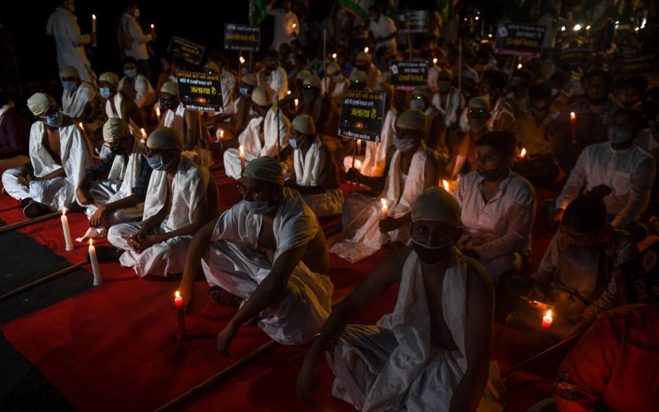 Activists of the Indian Youth Congress during a candlelit vigil to demand justice for Manisha Valmiki - Money Sharma/AFP