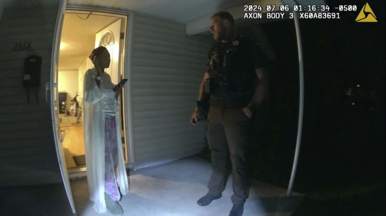 In this image taken from body camera video released by Illinois State Police, Sonya Massey, left, talks with former Sangamon County Sheriff's Deputy Sean Grayson outside her home in Springfield, Ill., July 6, 2024.  / Credit: Illinois State Police via AP