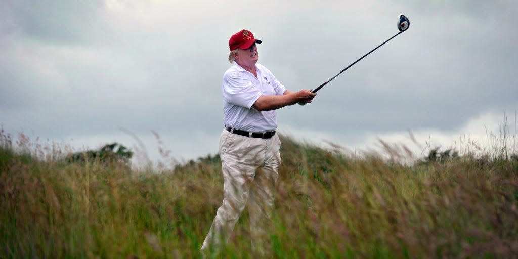 Donald Trump golfing at Trump International Golf Links course in Aberdeenshire, Scotland