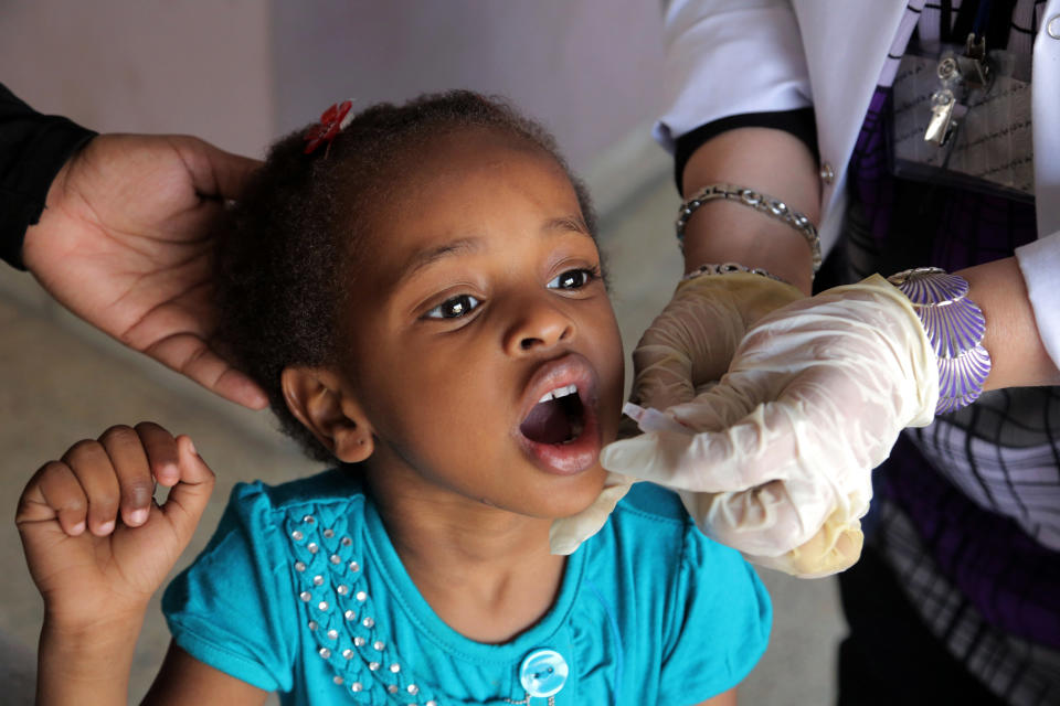 Darren Abdullah, 4, receives a polio vaccine at a health center in Baghdad, Iraq , Thursday, April 10, 2014. With the assistance of international health organizations, Iraqi health officials are scrambling to vaccinate millions of children across Iraq against the highly contagious polio virus in response to the outbreak of the disease in the country as well as the region, a spillover from the three-year-old war in neighboring Syria where handful of children have affected. (AP Photo/Khalid Mohammed)