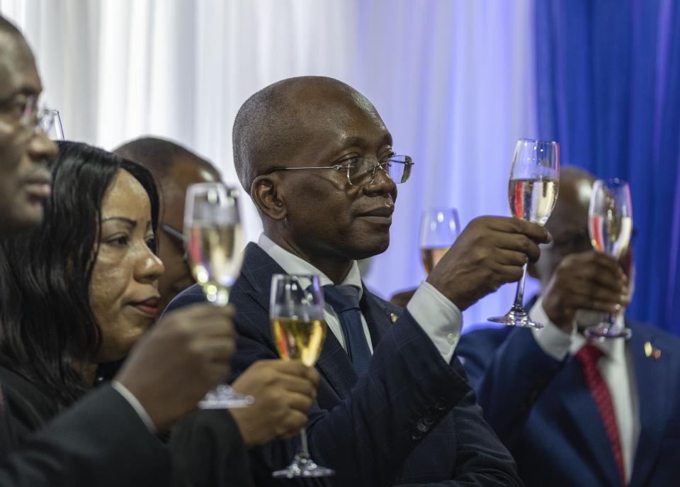 Michel Patrick Boisvert, who was named interim prime minister by the cabinet of outgoing Prime Minister Ariel Henry, toasts during the swearing-in ceremony of the transitional council tasked with selecting a new prime minister and cabinet, in Port-au-Prince, Haiti, April 25, 2024. (AP Photo/Ramon Espinosa)