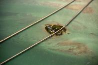 <p>The Seven Mile Bridge is a famous bridge in the Florida Keys, Florida. It connects Knights Key (part of the city of Marathon, Florida) in the Middle Keys to Little Duck Key in the Lower Keys. There are two bridges in this location. The modern bridge is open to vehicular traffic; the older one only to pedestrians and cyclists. The older bridge, originally known as the Knights Key-Pigeon Key-Moser Channel-Pacet Channel Bridge, was constructed from 1909 to 1912. (Photo: Jassen Todorov/Caters News) </p>