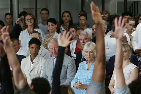 Britain's Prince Charles and Camilla, Duchess of Cornwall, with Cuban dancer Carlos Acosta and his wife Charlotte Acosta watch a dance performance at Acosta's dance studio in Havana, Cuba, March 25, 2019. REUTERS/Fernando Medina NO RESALES. NO ARCHIVE