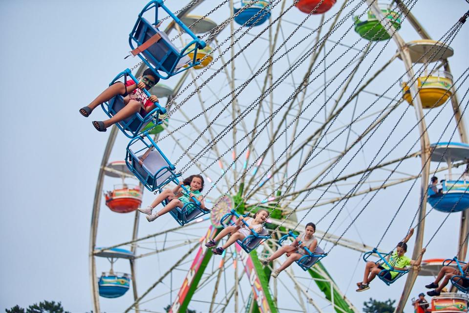 Fun seekers soar through the air at last year's Barnstable County Fair. The fair, which opens Monday and runs through Sunday, July 24, delivers carnival rides, music, animals, produce, crashing cars and fried food at the East Falmouth fairgrounds.