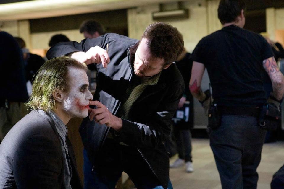 Heath Ledger as Joker with make-up artist John Caglione Jr. on-set