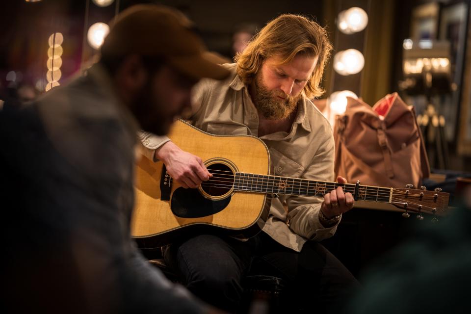 Charles Wesley Godwin warms up in his dressing room before his Opry debut.