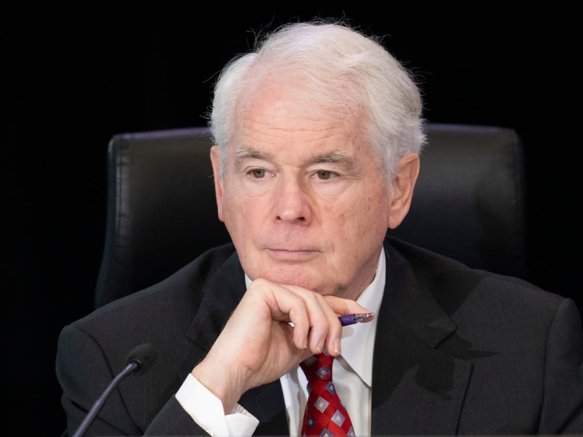 Commissioner Paul Rouleau watches a lawyer appear via video conference during the first day of proceedings at the Public Order Emergency Commission inquiry on Thursday, October 13, 2022 in Ottawa. (Adrian Wyld/The Canadian Press - image credit)