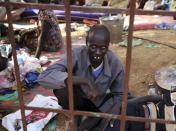 An internally displaced man sits inside a United Nations Missions in Sudan (UNMIS) compound in Juba December 19, 2013. South Sudanese government troops battled to regain control of a flashpoint town and sent forces to quell fighting in a vital oil producing area on Thursday, the fifth day of a conflict that that has deepended ethnic divisions in the two-year-old nation. REUTERS/Goran Tomasevic (SOUTH SUDAN - Tags: POLITICS CIVIL UNREST)