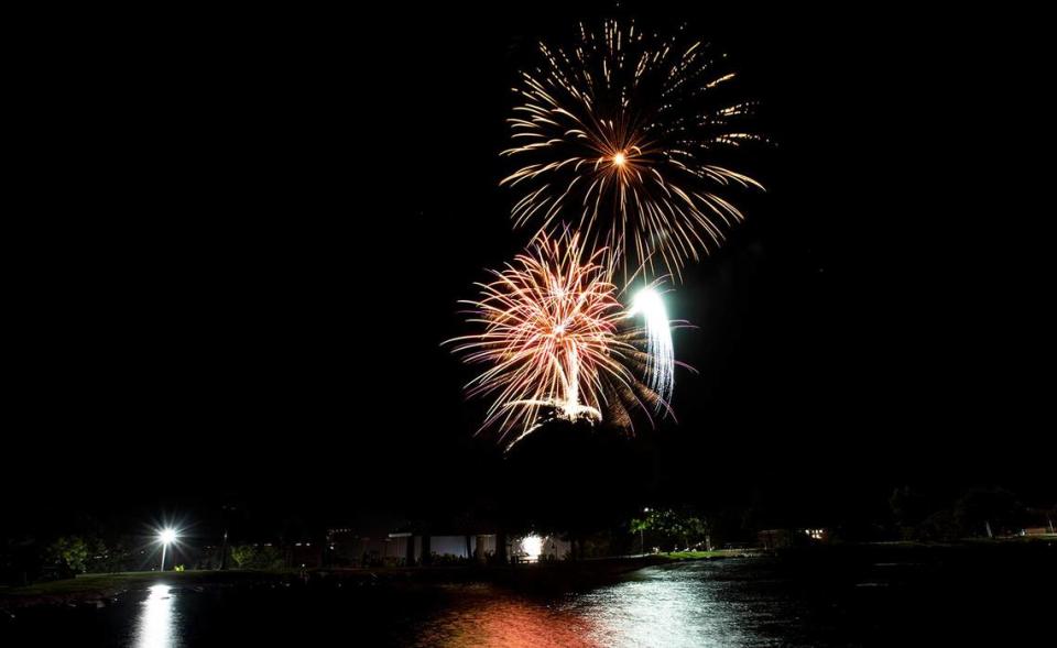 Fireworks light up the sky over the lake at Barney Schwartz Park in Paso Robles on Tuesday, July 4, 2023.