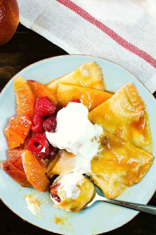 <p>The Flavor Bender</p><p>Pillowy soft crepes, coated in a blood orange-infused rich, buttery, citrusy caramelized syrup and served with extra blood orange segments, raspberries and a dollop of whipped cream.</p><p><strong>Get the recipe: <a href="https://www.theflavorbender.com/blood-orange-crepe-suzette-for-two/" rel="nofollow noopener" target="_blank" data-ylk="slk:Blood Orange Crepe Suzette for Two;elm:context_link;itc:0;sec:content-canvas" class="link ">Blood Orange Crepe Suzette for Two</a></strong></p>