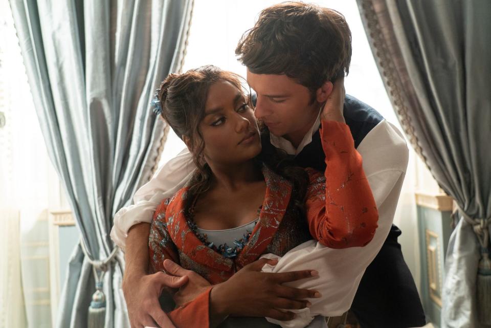 bridgerton season 3 photo showing simone ashley as kate and jonathan bailey as anthony in a passionate embrace