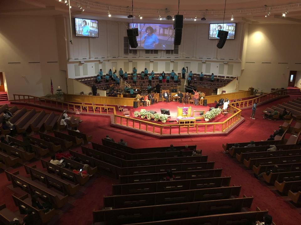 The choir sings during services on at St. Philip African Methodist Episcopal Church in Atlanta on Sunday, March 15, 2020. Only about 100 people filled a sprawling sanctuary that seats more than a thousand at the church because of coronavirus fears. Pastor William Watley told congregants he would follow officials' guidance on whether to continue services after Sunday, calling for prayer during the epidemic. (Jeff Amy/Associated Press)