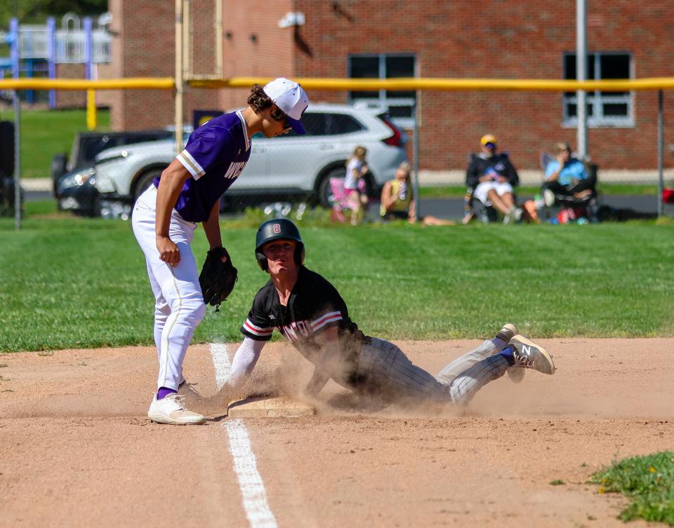 Clinton's Nik Shadley slides into third with a steal during Tuesday's doubleheader at Onsted.