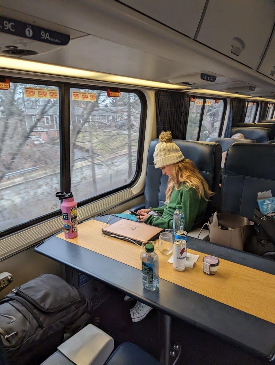Author Molly O'Brien sitting in first-class Amtrak seat 