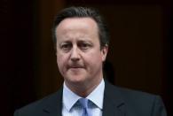 Britain's Prime Minister David Cameron leaves Downing Street in London, December 2, 2015. REUTERS/Suzanne Plunkett