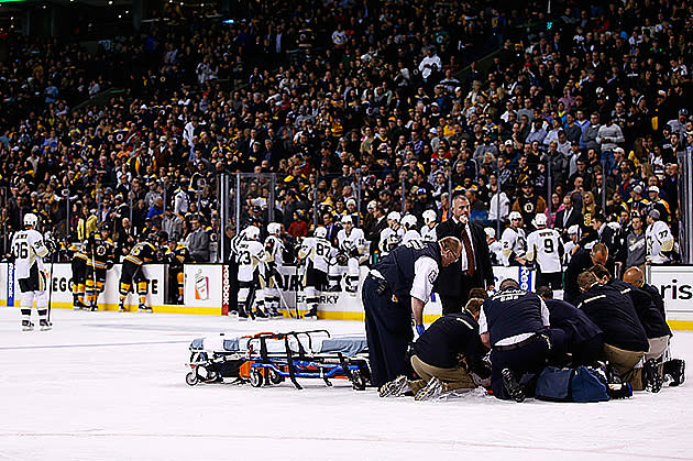 Boston Bruins player Shawn Thornton brings the Stanley Cup to