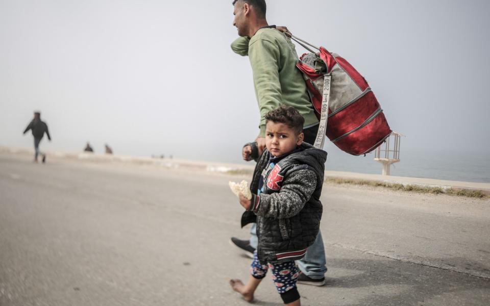 Palestinian people leave their homes with their belongings and travel to safer areas in order to protect themselves from Israeli bombardment and to ensure their safety in Deir al-Balah, Gaza on February 25, 2024