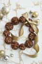 <p>Arrange any type of cookie (or baked good!) into a wreath and add an assortment of bows and ornaments for an instant dose of holiday cheer. </p><p>Get the <a href="https://www.countryliving.com/food-drinks/recipes/a40522/pinecone-brownie-wreath-recipe/" rel="nofollow noopener" target="_blank" data-ylk="slk:Pinecone Brownie Wreath recipe;elm:context_link;itc:0;sec:content-canvas" class="link "><strong>Pinecone Brownie Wreath recipe</strong></a> from Country Living.</p>