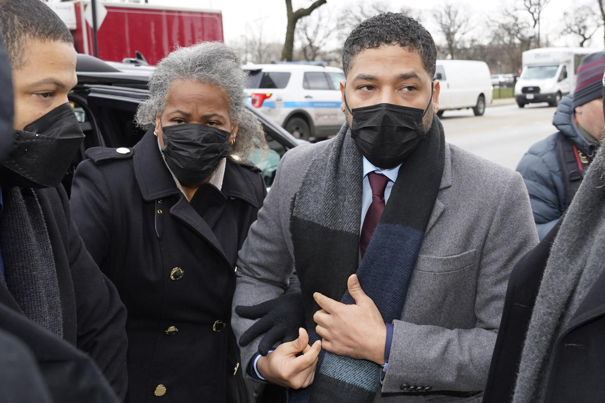 Actor Jussie Smollett arrives Monday, Dec. 6, 2021, with his mother Janet at the Leighton Criminal Courthouse for day five of his trial in Chicago. Smollett is accused of lying to police when he reported he was the victim of a racist, anti-gay attack in downtown Chicago nearly three years ago, in Chicago. (AP Photo/Charles Rex Arbogast)