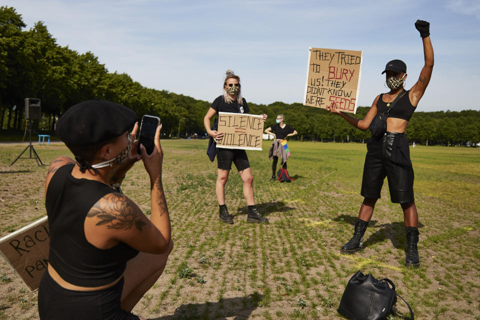 THE HAGUE, NETHERLANDS - JUNE 02: A protester holds a sign in protest as people gather on Malieveld in The Hague to attend a solidarity rally against racism in the aftermath of the killing of George Floyd by U.S. police officers on June 2, 2020 in The Hague, Netherlands. The rally is organized by KOZP (Kick Out Zwarte Piet), anti-racist activists against the Dutch Christmas tradition when people paint their face black and disguise in slave. (Photo by Pierre Crom/Getty Images)