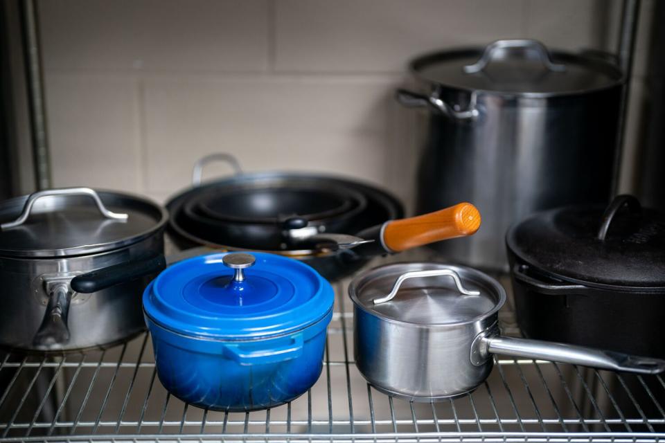 The kitchen in the "Little Scandinavia" unit is stocked with colorful cooking utensils.