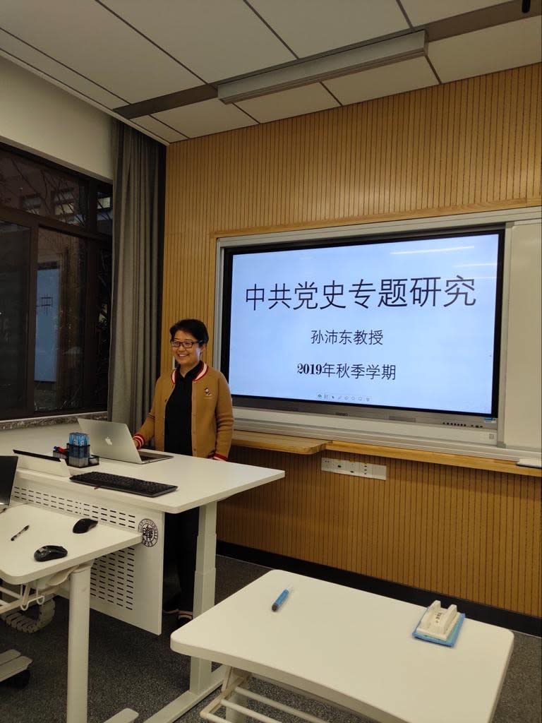 Sun Peidong stands in front of a classroom at Fudan University in December 2019.