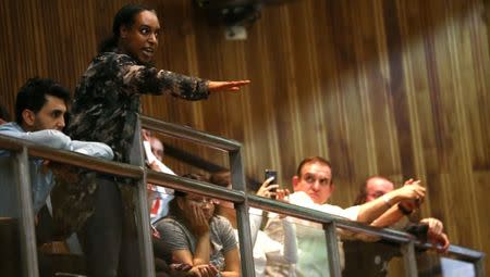 A member from the public speaks at a Kensington and Chelsea Council meeting about Grenfell Tower at Kensington Town Hall in London, Britain July 19, 2017. REUTERS/Neil Hall