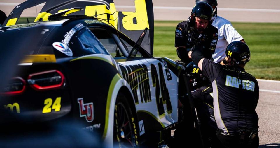 Hendrick Motorsports crew works on the No. 24 Chevrolet during practice at Kansas Speedway