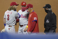 Philadelphia Phillies' Bryce Harper talks next to manager Joe Girardi (25) after being thrown out of the baseball game by umpire Roberto Ortiz during the fifth inning against the New York Mets, Saturday, Sept. 5, 2020, in New York. (AP Photo/John Minchillo)