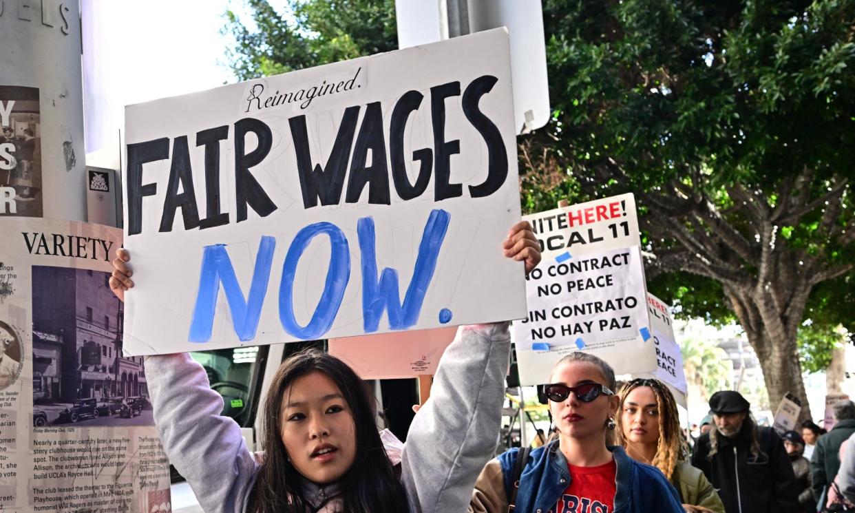 <span>Hospitality workers picket outside Hotel Figueroa in downtown LA on 5 April 2024.</span><span>Photograph: Frederic J Brown/AFP/Getty Images</span>