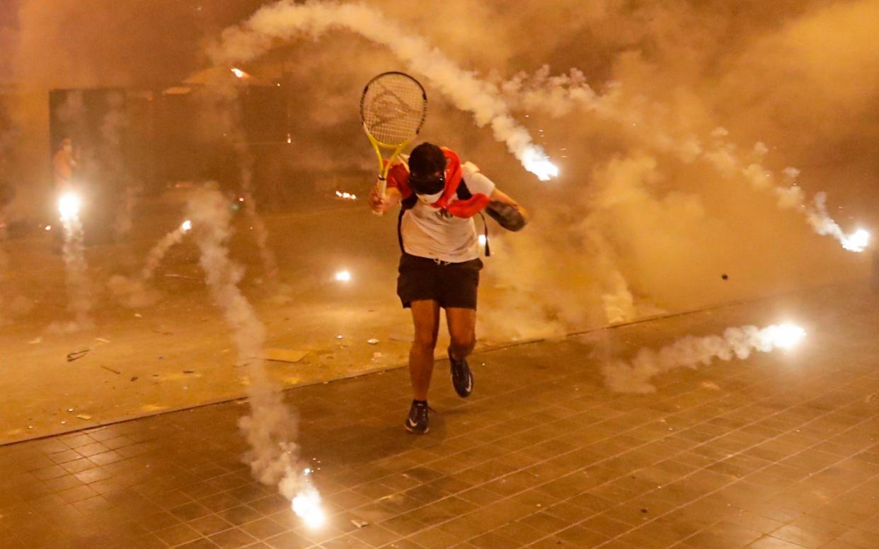 Protesters calling for the resignation of Lebanon's government clashed with security forces in Beirut for two nights over the weekend - AFP