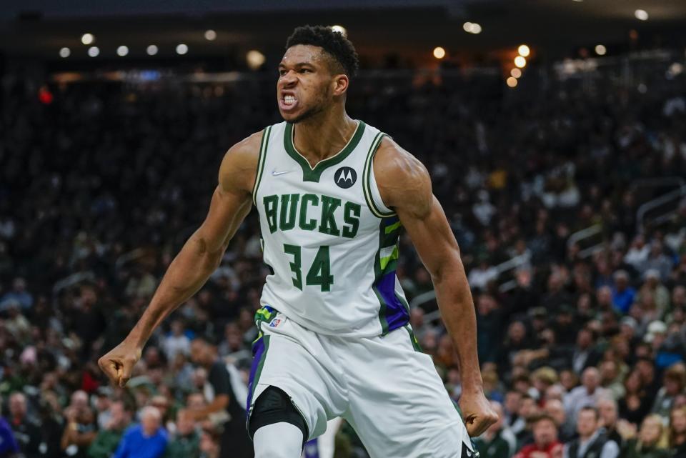 Milwaukee Bucks' Giannis Antetokounmpo reacts during the second half of an NBA basketball game against the Charlotte Hornets Wednesday, Dec. 1, 2021, in Milwaukee. The Bucks won 127-125. (AP Photo/Morry Gash)